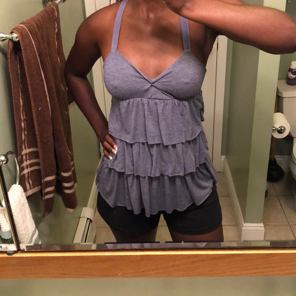A periwinkle cami with flowered straps